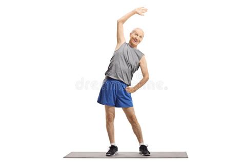 Elderly Man Doing A Stretching Exercise On A Mat Stock Photo Image Of