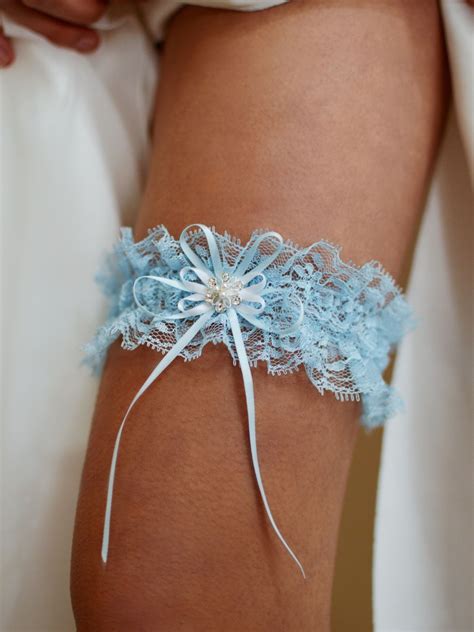 Tlg Is A Gorgeous Blue Lace Bridal Garter With A Pretty Diamante And White Pearl Design