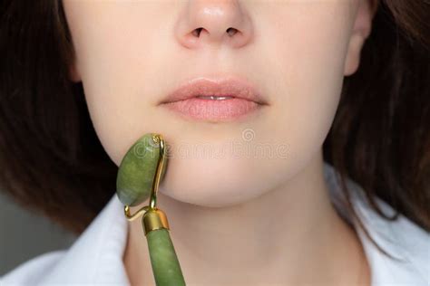 Woman With Jade Face Roller Stock Image Image Of Relax Soothing 180275979