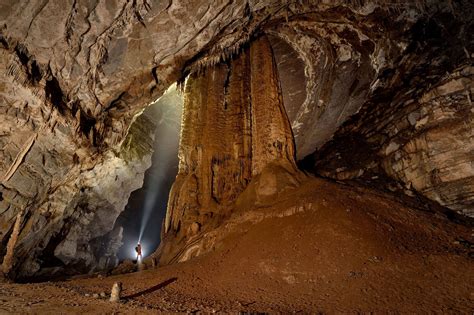 Picture Of A Caver Exploring A Large Cave In China Cave Photography