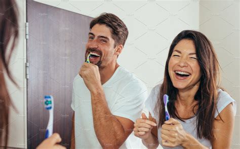 Smiling Couple Brushing Teeth People Images ~ Creative Market