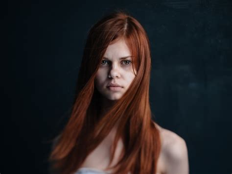Premium Photo Portrait Of A Woman With Red Hair On A Black Background Naked Shoulders Model