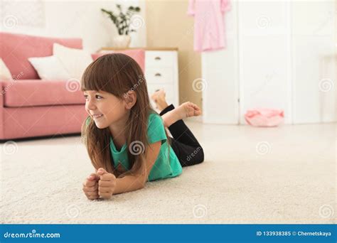 Cute Little Girl Lying On Carpet At Home Stock Image Image Of Length