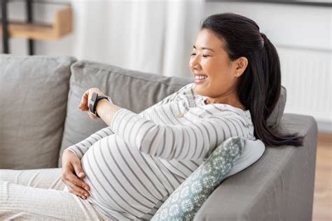 Happy Pregnant Woman With Smart Watch At Home Stock Image Image Of Asian Expecting 221563011