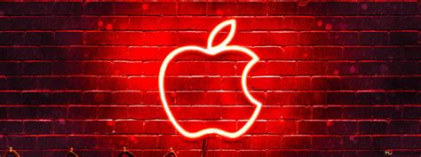 Red Illuminated Apple Logo Hanging On A Stone Wall 4k Wallpaper Download