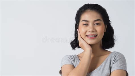 Asian Teen Facial With Braces Smiling To Camera To Show Orthodonic
