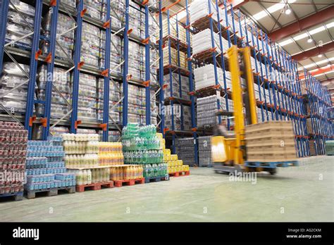 Forklift Driver in Warehouse Stock Photo - Alamy