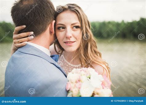 Bride And Groom Holding Beautiful Wedding Bouquet Lake Forest Stock