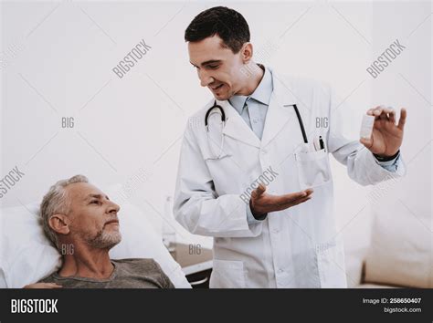 Doctor Help Patient Image And Photo Free Trial Bigstock