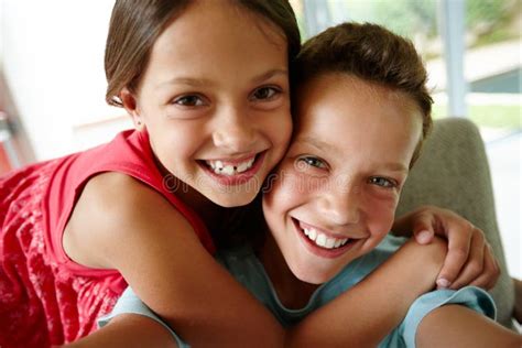 Siblings And Friends Portrait Of An Affectionate Brother And Sister At Home Stock Image