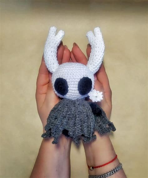 Hollow Knight crochet toy with little flower in his hand | Etsy