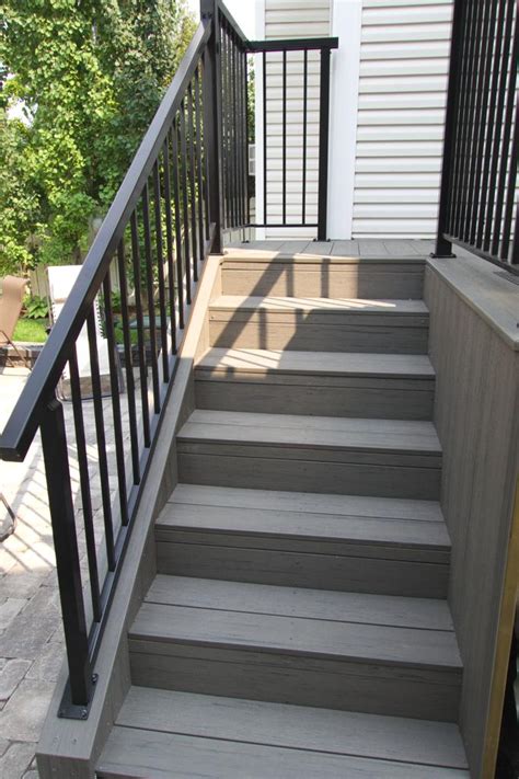 Leave 1/4 between the first and second tread board and attach with deck screws. Deck Construction Calgary - Landscaping Company | Assiniboine