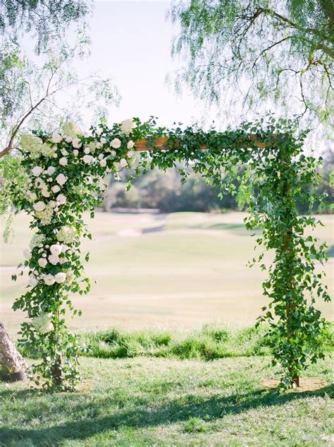 Romantic Wood Arch Covered In Greenery And Flowers Outdoor Ceremony