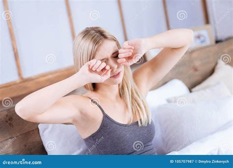 Young Woman Rubbing Her Eyes Having Woke Up Stock Image Image Of Comfort Bedroom 105707987