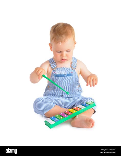 Cheerful Baby Boy Playing On Xylophone Isolated Over White Background