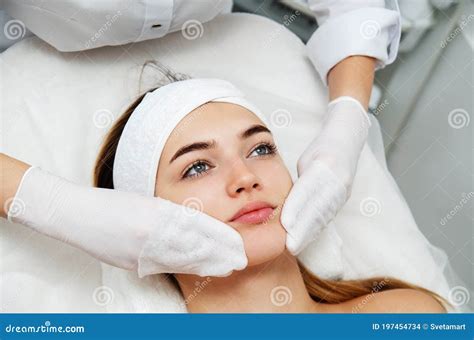 Young Woman Getting Facial Beauty Treatment Beautician Cleaning And