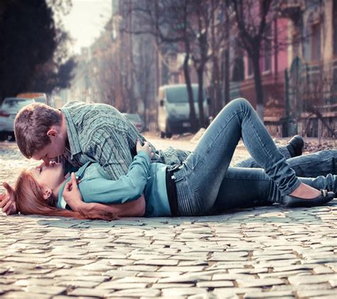 Download Cute Couple Kissing On Road Wallpaper