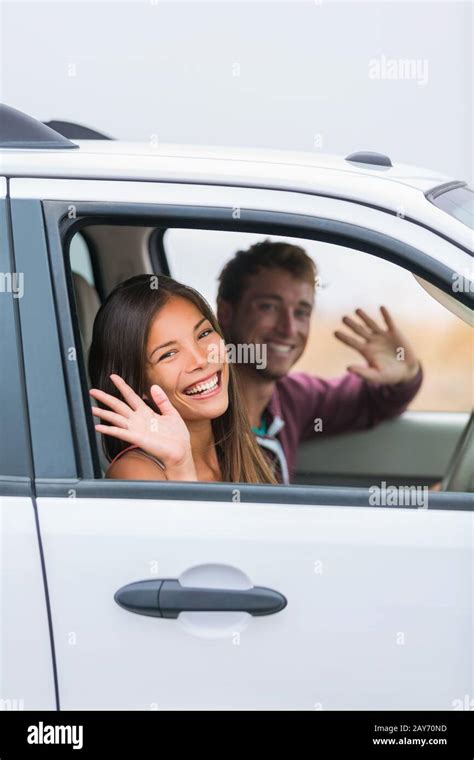 Happy Multiracial Couple Leaving For Road Trip On Summer Vacation