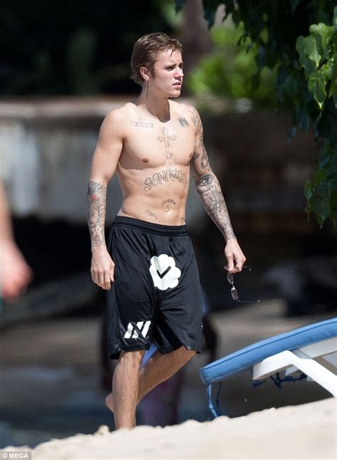 shirtless justin bieber shows off physique as he hits barbados with brother daily mail online
