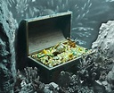 Treasure chest full of gold under the sea - Institute for Justice