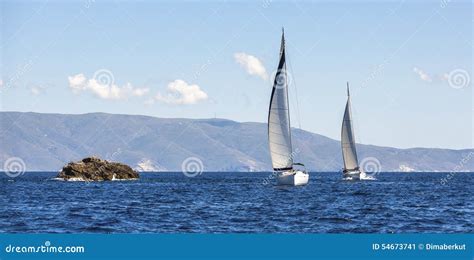 Two Sailing Boats Yacht Or Sail Regatta Race On Blue Water Sea Sport