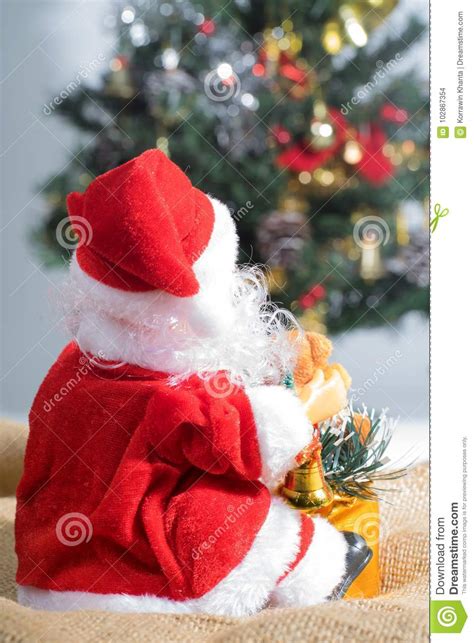 Behind The Santa Claus And Christmas Tree Background Stock Photo