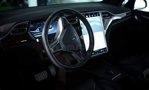 Inside View Of Tesla Electric Vehicle Sreering Wheel And Displays