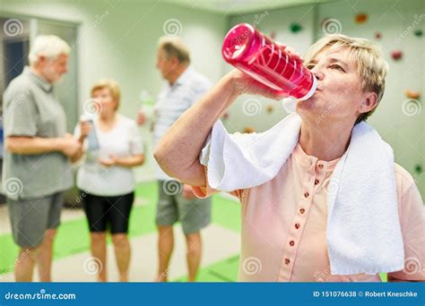 Senior Woman Drinks Water During Fitness Workout Stock Photo Image Of