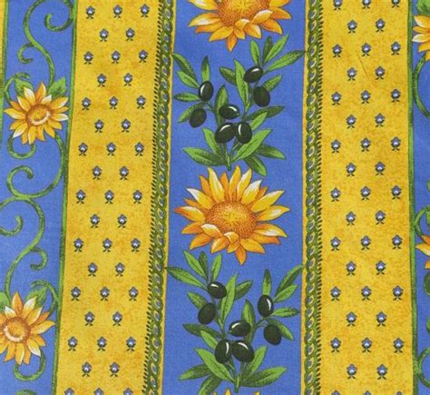 A Blue And Yellow Striped Fabric With Sunflowers On The Bottom Black