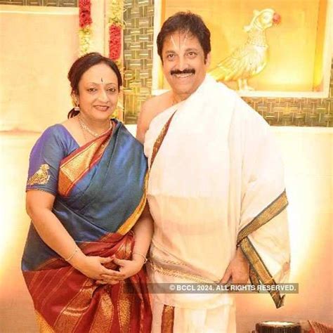 Lakshmi And Ravi Raghavendra Pose For A Photo During Their Daughter