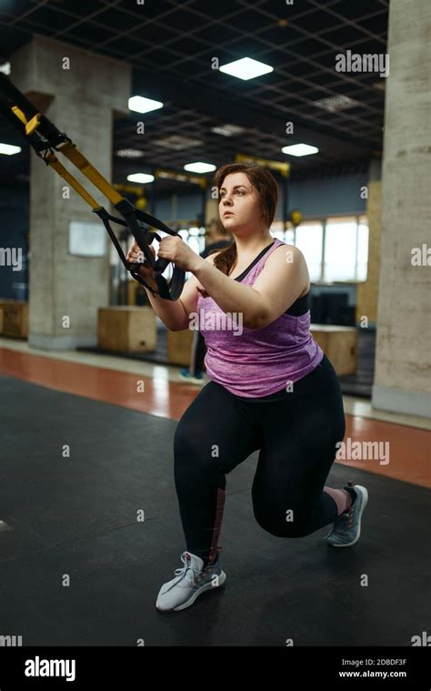 Overweight Woman Doing Stretching Exercise In Gym Active Training