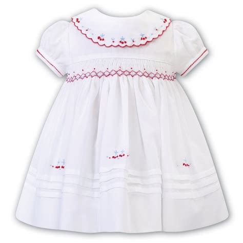 Sarah Louise Girls Red Embroidered And Smocked Neckline Dress