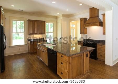 Kitchens of instagram on instagram: Large Luxurious Kitchen With Maple Cabinets And Black ...