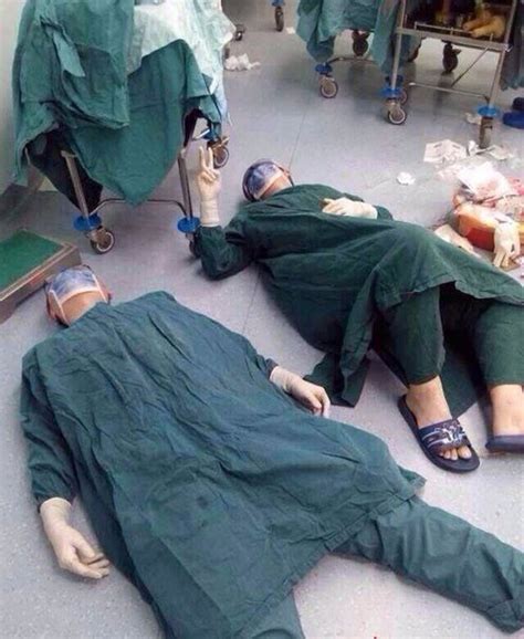 2 Surgeons After Successfully Removing A Set Of Brain Tumors During A