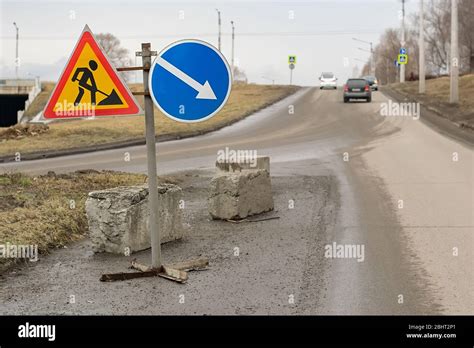 Road Sign Detour Road Repair On Asphalt Road On Highway Stock Photo