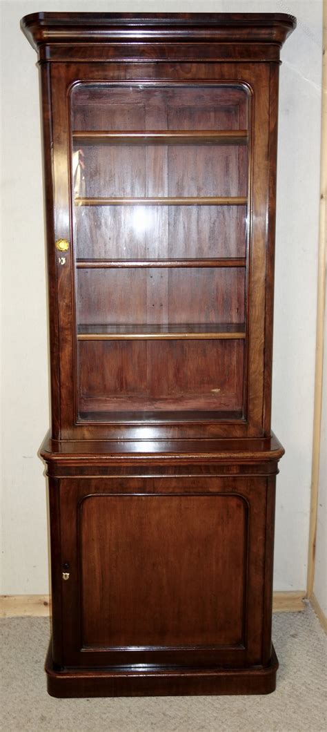 Pair of mahogany library bookcases, each with moulded cornice, above a pair of glazed panelled doors. Tall & Narrow Victorian Mahogany Bookcase - Antiques Atlas