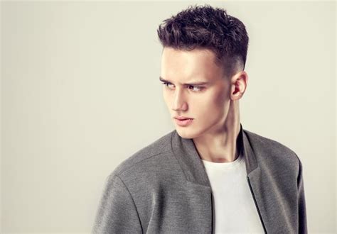 Premium Photo Fashionable Short Haircut On The Head Of Young Handsome