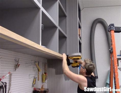 I've been wanting to cover the middle section of my workshop cabinets with sliding doors. Easy DIY Sliding Doors for Cabinets - Sawdust Girl®