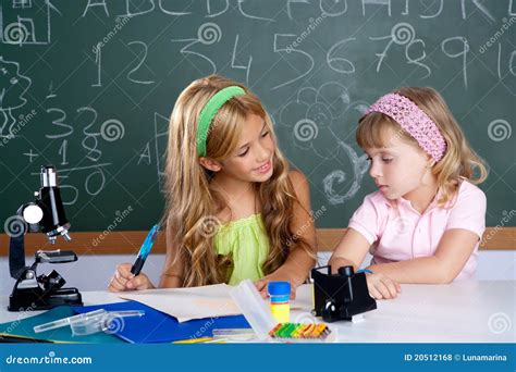 Kids Students In Classroom Helping Each Other Royalty Free Stock Photos