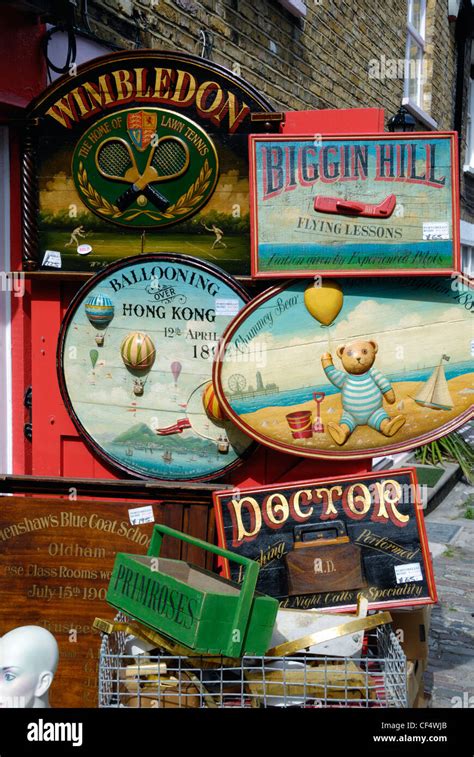 Lots Of Old Hand Painted Wooden Advertising Signs For Sale Outside An