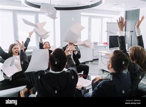 Euphoric Overjoyed Diverse Business Team Tossing Throwing Papers