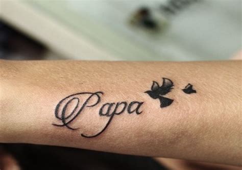 A Person With A Tattoo On Their Arm That Reads Papa And Birds Are
