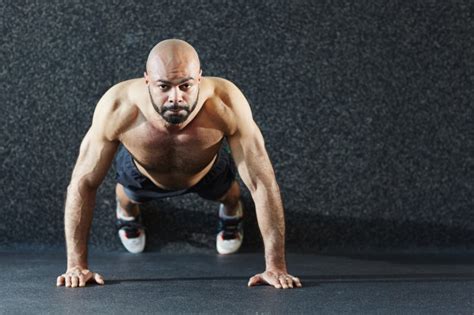 Muscular Man Doing Push Ups In Gym Photo Free Download