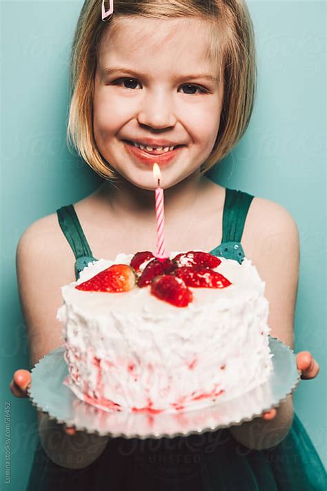 Girl Holding Birthday Cake By Lumina Stocksy United