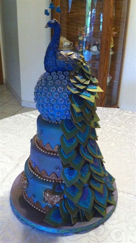 Once you've learned that trick you'll be ready to use this technique on whatever design you like to. Peacock Cake - CakeCentral.com