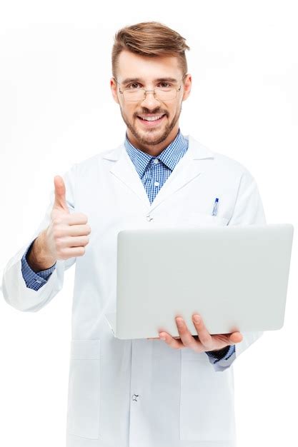 Premium Photo Happy Male Doctor Holding Laptop Computer And Showing