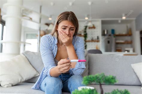 Premium Photo Shocked Woman Looking At Control Line On Pregnancy Test Single Sad Woman