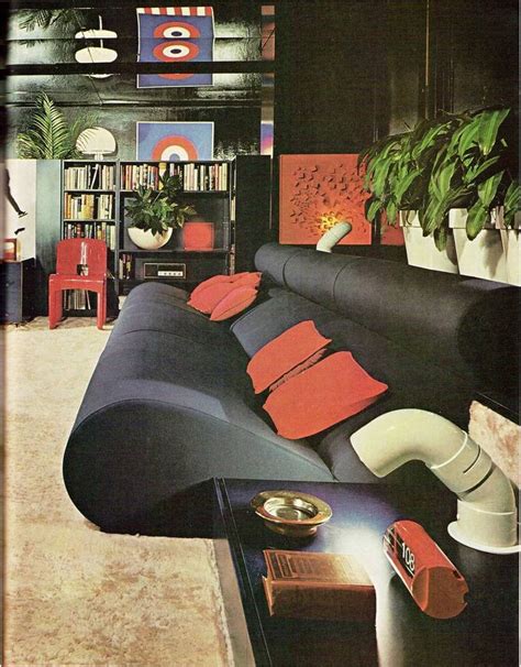 An Old Photo Of A Living Room With Couches And Bookshelves In It