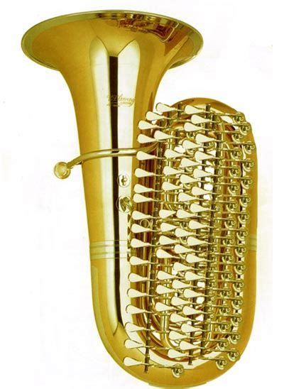 A Gold Colored Musical Instrument With Spikes On Its Sides And The