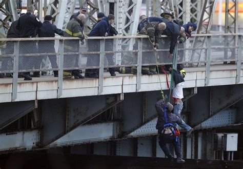 Man Hanging Off Bridge Rescued By Emergency Responders Photos